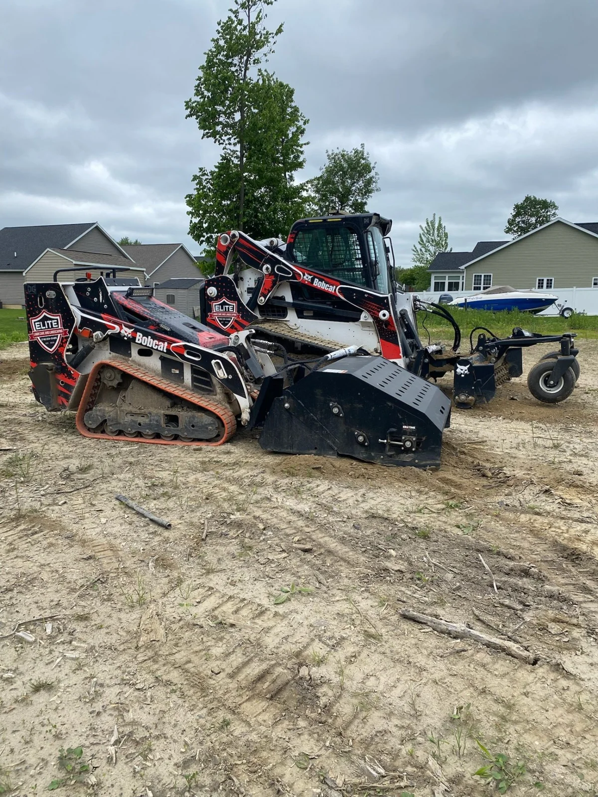 Compact equipment preparing and leveling a residential yard