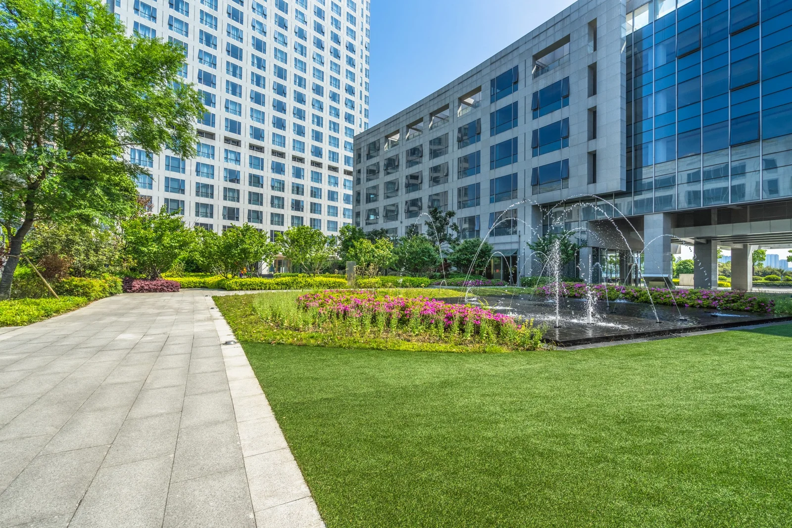 Landscaped courtyard and paths outside office buildings
